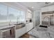 Bright kitchen with marble countertops, stainless steel appliances, and a farmhouse sink at 3401 N 34Th Pl, Phoenix, AZ 85018