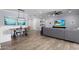 Open-concept living space with dining area, wood floors, modern lighting, and stylish decor at 3401 N 34Th Pl, Phoenix, AZ 85018