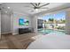 Main bedroom features ceiling fan, tv and large sliding doors to the pool at 3401 N 34Th Pl, Phoenix, AZ 85018