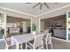 Charming patio with modern dining set, seamlessly connected to the kitchen and living areas through sliding glass doors at 3401 N 34Th Pl, Phoenix, AZ 85018