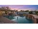Inviting pool area features a brick surround, lounge chairs, and a covered patio, perfect for relaxation at 3401 N 34Th Pl, Phoenix, AZ 85018