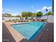 Relaxing pool with brick border, mature landscaping and outdoor seating at 3401 N 34Th Pl, Phoenix, AZ 85018