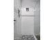 This shower boasts white subway tile, stylish mosaic accents, and a convenient built-in niche at 3401 N 34Th Pl, Phoenix, AZ 85018