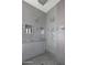 Walk-in shower with rain shower head and built-in shampoo shelves at 3401 N 34Th Pl, Phoenix, AZ 85018