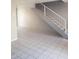 Inviting living room featuring neutral colors, tile flooring, and staircase at 3526 W Dunlap Ave # 161, Phoenix, AZ 85051