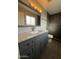 Bathroom showcasing a vanity with a marble countertop and modern fixtures at 3739 W Mission Ln, Phoenix, AZ 85051