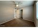 Bedroom features a ceiling fan, a closet, and a large window with blinds at 3739 W Mission Ln, Phoenix, AZ 85051