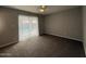 Bedroom with a sliding glass door leading to a patio and pool at 3739 W Mission Ln, Phoenix, AZ 85051