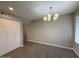 Dining area with sleek tile floors, contemporary lighting, and closet at 3739 W Mission Ln, Phoenix, AZ 85051