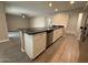 Open kitchen with a central island, granite countertops and stainless steel appliances at 3739 W Mission Ln, Phoenix, AZ 85051