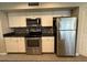 Modern kitchen featuring stainless steel appliances and updated countertops at 3739 W Mission Ln, Phoenix, AZ 85051