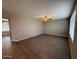 Spacious living room featuring wood-look tile flooring and a ceiling fan at 3739 W Mission Ln, Phoenix, AZ 85051
