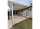 Covered patio area with sliding glass doors, offering a view of the backyard at 3739 W Mission Ln, Phoenix, AZ 85051