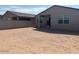 Large backyard with patio, surrounded by block wall fencing for privacy at 3822 S 87Th Dr, Tolleson, AZ 85353