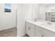 Bathroom with dual sinks and modern fixtures at 3822 S 87Th Dr, Tolleson, AZ 85353