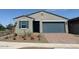 Charming single-story home with a two-car garage and a well-maintained front yard at 3822 S 87Th Dr, Tolleson, AZ 85353