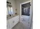 Modern bathroom featuring a vanity with a marble countertop and a tiled walk-in shower at 38434 W Buckeye Rd, Tonopah, AZ 85354