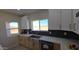 Bright kitchen featuring stainless steel appliances, two-tone cabinets and countertops at 38434 W Buckeye Rd, Tonopah, AZ 85354