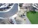 Wide aerial shot showcases neighborhood streets, homes with desert landscaping, and community park at 4405 W Park St, Laveen, AZ 85339