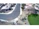 Community streets and houses with low desert landscaping with a lush, grassy green park at 4405 W Park St, Laveen, AZ 85339