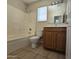 Cozy bathroom with a shower-tub combination, a vanity with ample storage, and neutral tile flooring at 4405 W Park St, Laveen, AZ 85339