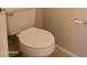 Standard bathroom with a white toilet, tile flooring and a wall-mounted toilet paper holder at 4405 W Park St, Laveen, AZ 85339