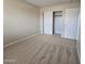 Bright bedroom featuring neutral carpet, a spacious closet, and freshly painted walls at 4405 W Park St, Laveen, AZ 85339
