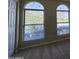 Bedroom view with decorative windows overlooking the greenery outside, creating a serene living space at 4405 W Park St, Laveen, AZ 85339