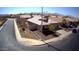 Single story home with a well-maintained yard and two-car garage in a quiet neighborhood setting at 4405 W Park St, Laveen, AZ 85339