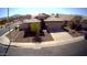 Single-Gathering home with a well-kept lawn and a two-car garage in a suburban neighborhood at 4405 W Park St, Laveen, AZ 85339