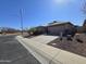 Single-Gathering home with desert landscaping and a two-car garage, situated on a corner lot in a quiet neighborhood at 4405 W Park St, Laveen, AZ 85339