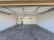 Spacious two-car garage featuring painted walls, concrete floors, and a functional utility sink at 4405 W Park St, Laveen, AZ 85339