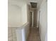 Upstairs hallway showcases neutral walls, with easy access to bedrooms and bathrooms at 4405 W Park St, Laveen, AZ 85339
