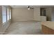 Bright living room featuring neutral walls, tile flooring, and a ceiling fan at 4405 W Park St, Laveen, AZ 85339