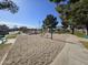 Community park with swings, a covered ramada, and well-maintained green spaces for Gathering enjoyment at 4405 W Park St, Laveen, AZ 85339