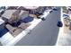 Aerial view of the neighborhood, showcasing tidy landscaping, single-Gathering homes and residential street at 4405 W Park St, Laveen, AZ 85339