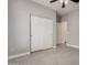 Bedroom featuring tile floors, a closet, and neutral paint at 5108 N 191St Dr, Litchfield Park, AZ 85340