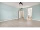 Spacious bedroom featuring tile floors, neutral paint, and access to the bathroom at 5108 N 191St Dr, Litchfield Park, AZ 85340