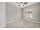 Bedroom featuring tile floors, a ceiling fan, and neutral paint at 5108 N 191St Dr, Litchfield Park, AZ 85340