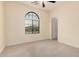 Bedroom featuring tile floors, cream walls, and a window at 5108 N 191St Dr, Litchfield Park, AZ 85340