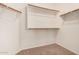 Walk-in closet with shelving and carpet flooring at 5108 N 191St Dr, Litchfield Park, AZ 85340