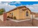 Charming single-story home with a tile roof, stucco walls, and a well-maintained desert landscape at 5108 N 191St Dr, Litchfield Park, AZ 85340