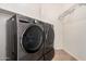 Laundry room includes gray LG washer and dryer set, and white wire shelving at 5108 N 191St Dr, Litchfield Park, AZ 85340