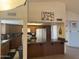 Open-concept kitchen featuring granite countertops and wood cabinets at 518 W Beverly Ln, Phoenix, AZ 85023