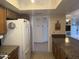 Open kitchen featuring granite countertops, wood cabinets, and tile floors at 518 W Beverly Ln, Phoenix, AZ 85023