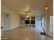 Bright living room featuring tile flooring, built-in shelves, and a cozy fireplace at 518 W Beverly Ln, Phoenix, AZ 85023