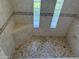 Shower featuring light tile floors and walls and glass-block windows at 518 W Beverly Ln, Phoenix, AZ 85023