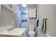 Bathroom features a vanity sink, toilet, storage cabinet, and washer and dryer at 7750 E Broadway Rd # 225, Mesa, AZ 85208