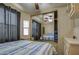 Bedroom with large closet mirror and neutral decor at 7750 E Broadway Rd # 225, Mesa, AZ 85208