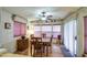 Charming dining room with wood floors and natural light from large windows at 7750 E Broadway Rd # 225, Mesa, AZ 85208